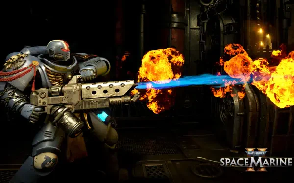 4K Ultra HD PC desktop wallpaper: video game Warhammer Space Marine firing a blue flame weapon amid fiery explosions in a dark industrial sci‑fi corridor, Space Marine logo at bottom right.