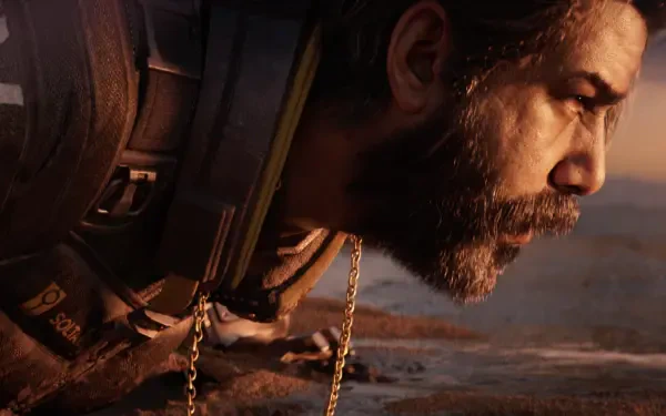 Close-up of a bearded video game character from Saros in 4K Ultra HD, gritty profile with tactical gear and warm desert light — PC desktop wallpaper and background.