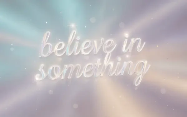 4K Ultra HD PC desktop wallpaper: believe in something in glowing script over soft pastel rays and gentle bokeh light.
