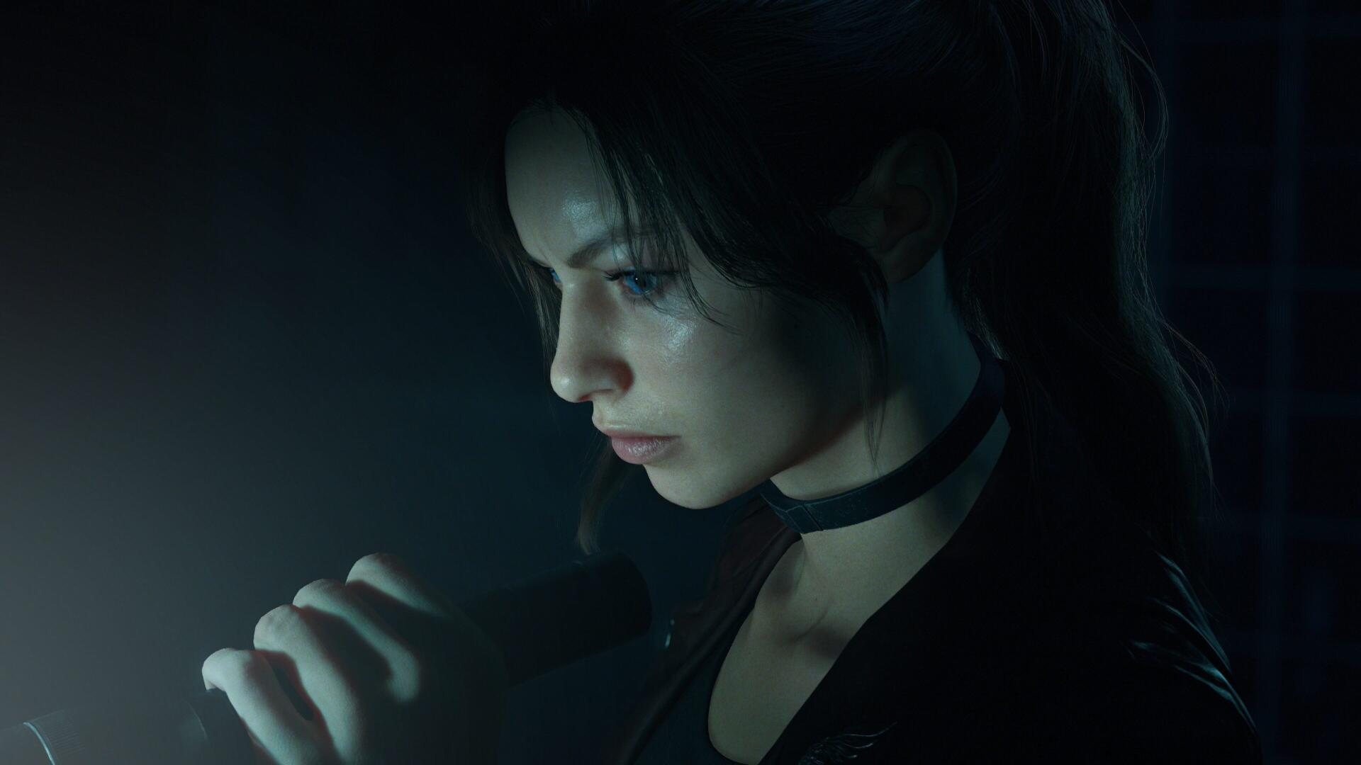 Close-up of a character from Resident Evil: Code Veronica, lit by a small handheld light in a dark scene — 4K Ultra HD PC desktop wallpaper and background.