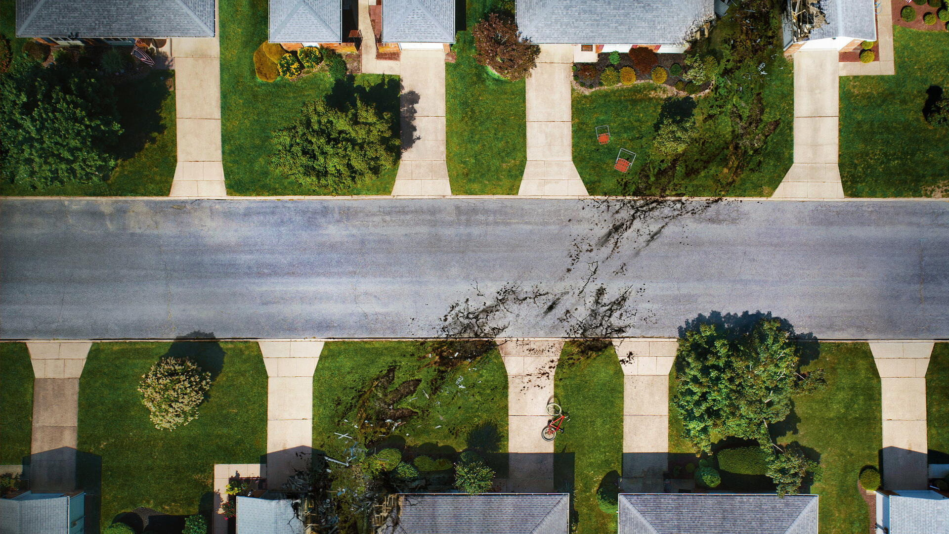 Aerial view titled The End of Oak Street — 4K Ultra HD PC desktop wallpaper showing a suburban street end with tidy lawns, sidewalks, driveways and scattered trees.