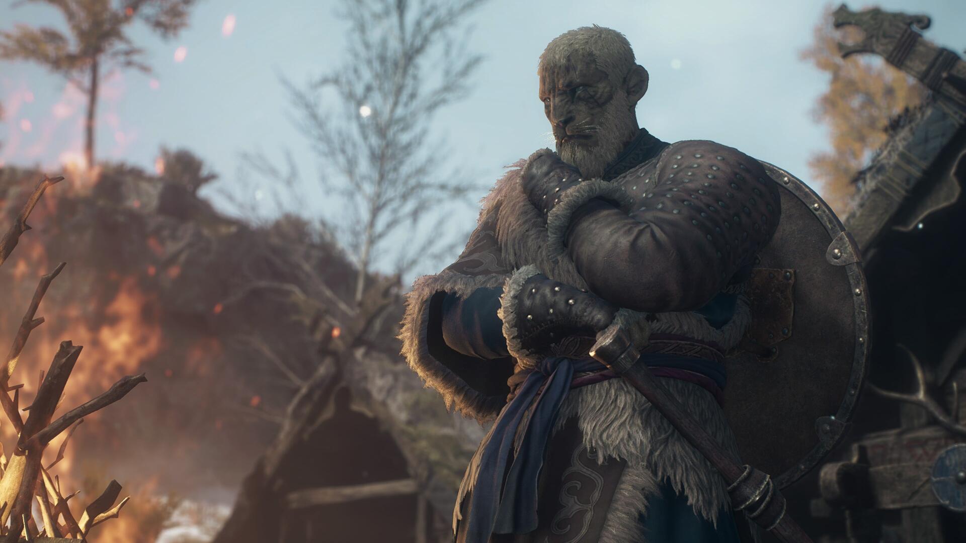 Burly Viking warrior in fur-lined armor and round shield, arms crossed amid fire and snow — Dragon's Dogma 2 Dark Arisen 4K Ultra HD PC desktop wallpaper.
