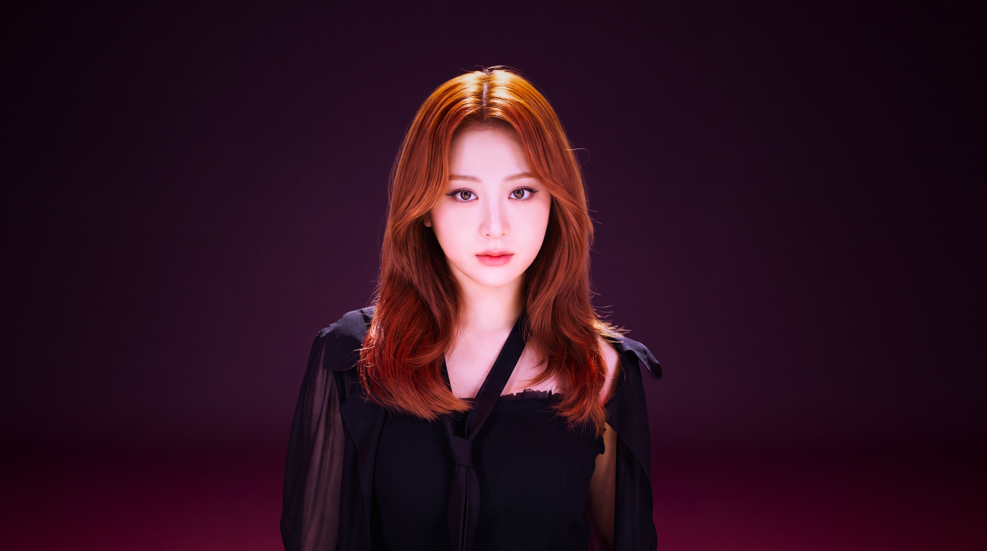 Close-up portrait of a redhead K-pop idol in a black top against a deep magenta backdrop — polished 5K Ultra HD PC desktop wallpaper and background.