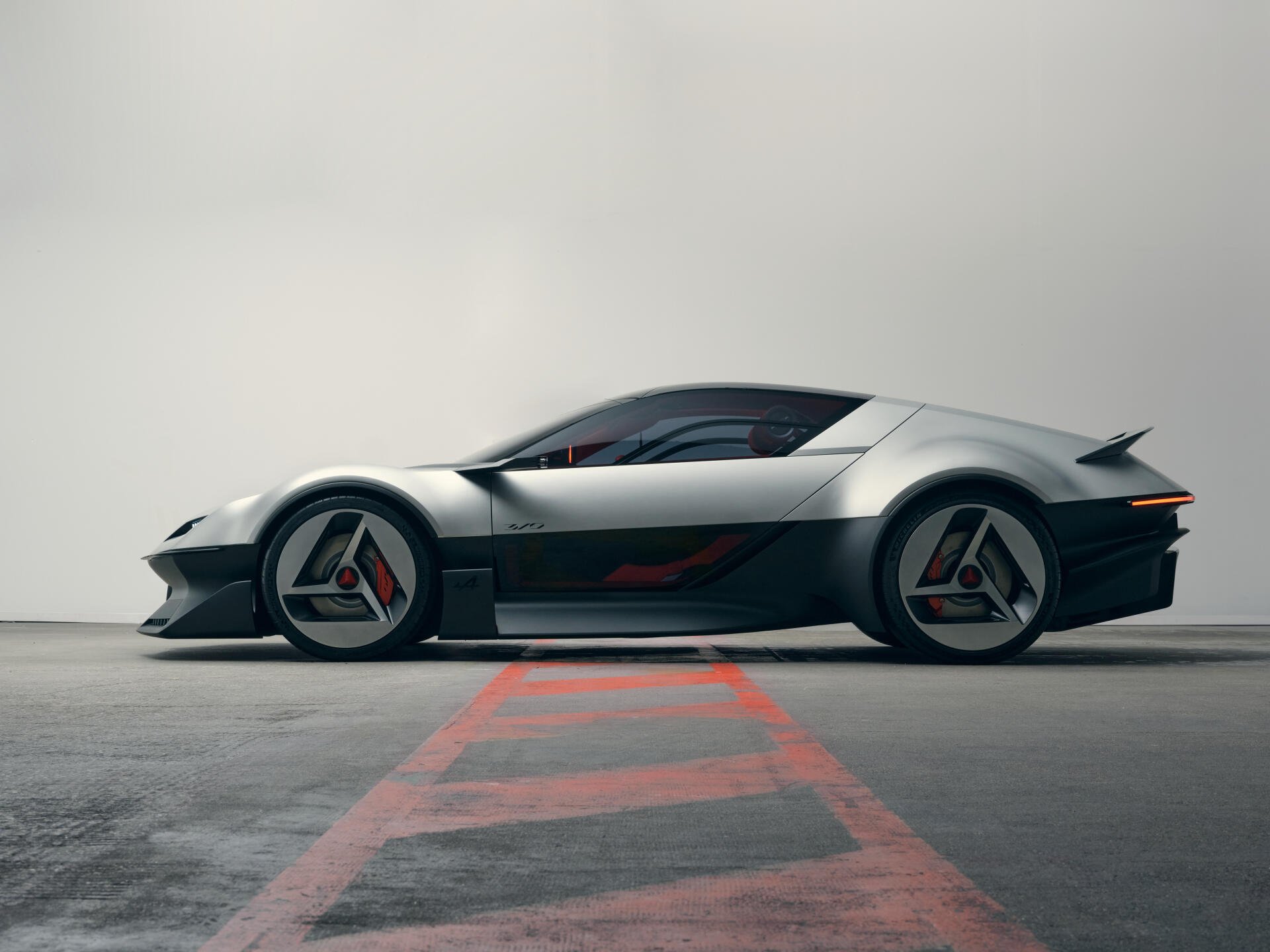 Alpine A310 Vision concept sports car in a sleek side profile, featured in a 5K Ultra HD PC desktop wallpaper.