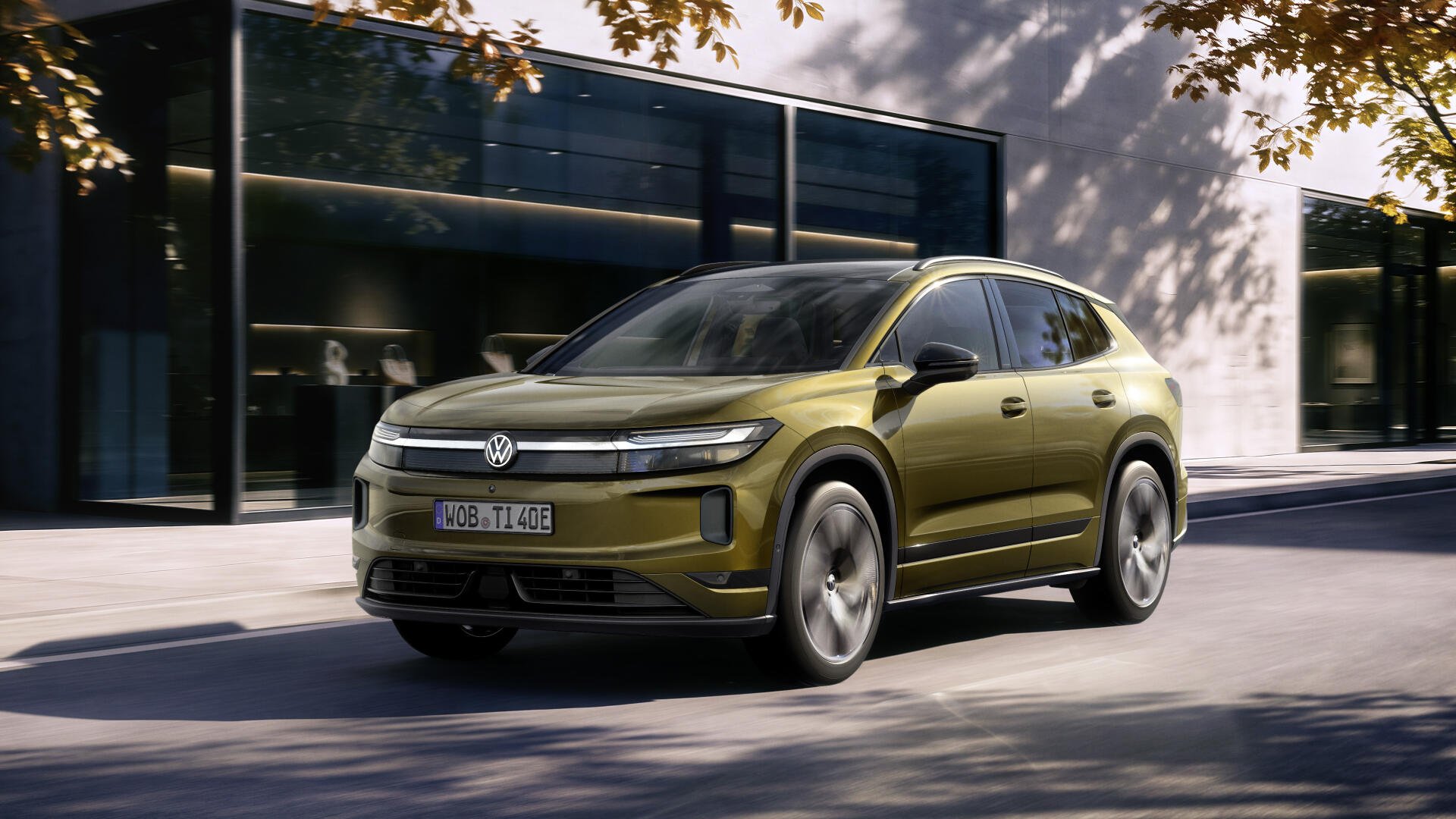 Olive Volkswagen ID. Tiguan SUV parked on a city street, 4K Ultra HD PC desktop wallpaper and background.