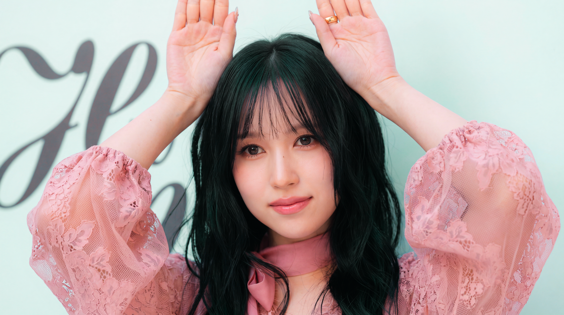 TWICE and MiSaMo member Mina, Japanese model and K-pop idol, poses in a pink blouse in this 5K Ultra HD desktop wallpaper.