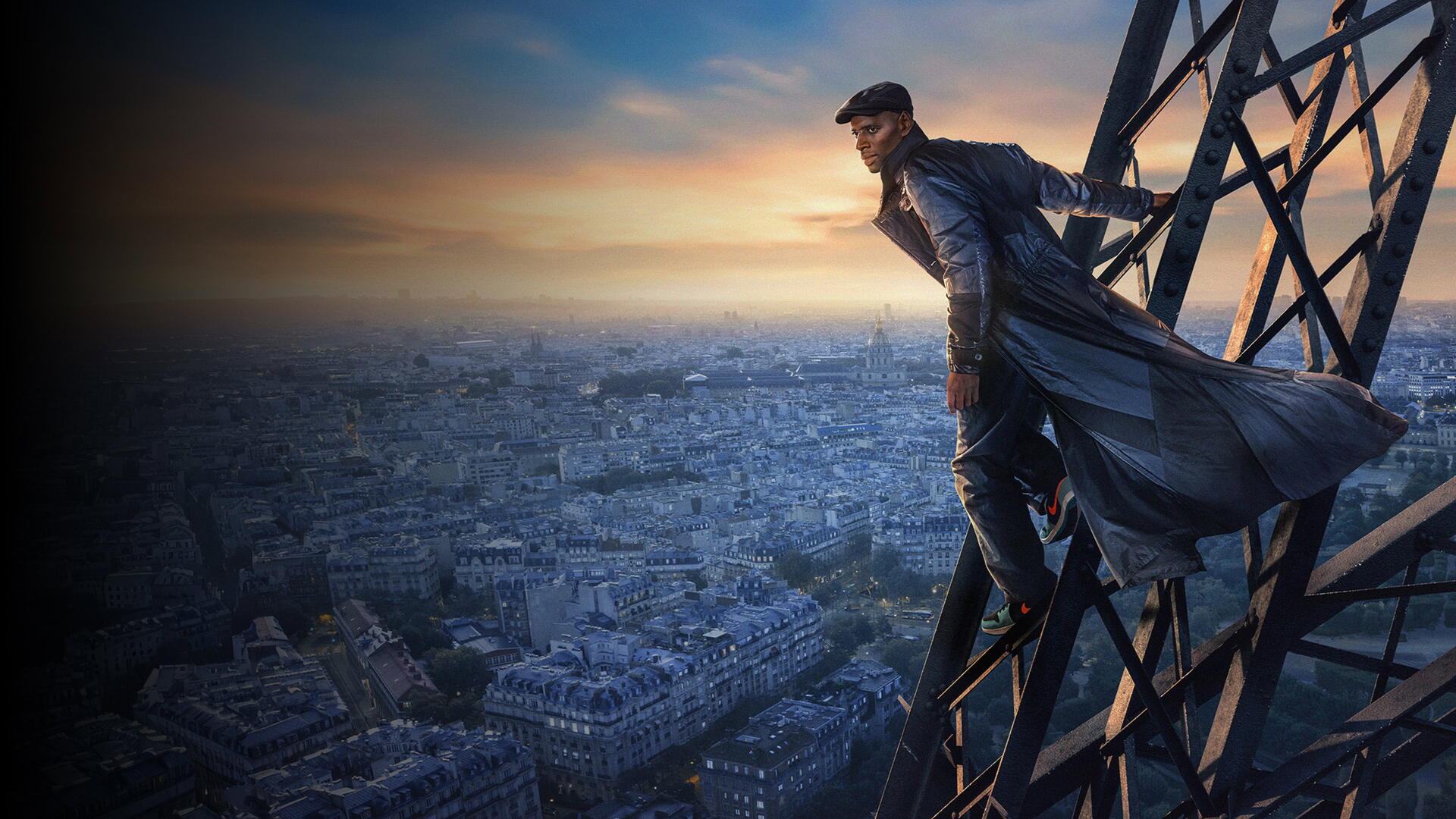 Lupin (2021) 4K Ultra HD PC desktop wallpaper showing a man in a dark coat perched on a steel structure above Paris at sunset.