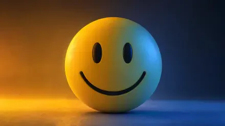 Glossy yellow smiley sphere centered on a warm orange to cool blue gradient — 4K Ultra HD PC desktop wallpaper and background.