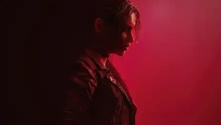 Side-profile of Claire Redfield in red light from Resident Evil Code: Veronica Remake — 4K Ultra HD PC desktop wallpaper and background.