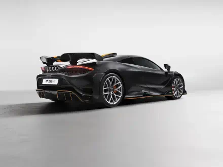 Matte black McLaren 788HS sports car, rear three-quarter view on a minimalist gray studio backdrop — 8K Ultra HD PC desktop wallpaper and background.