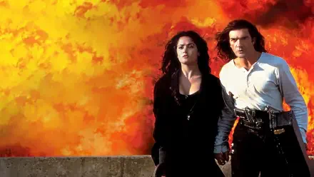 Desperado 4K Ultra HD PC desktop wallpaper and background: a man and woman hold hands on a concrete ledge as a fiery orange explosion fills the sky behind them.