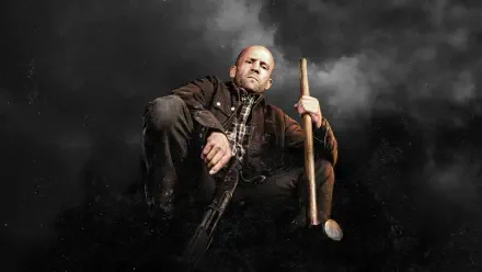 Working man in a worn jacket and plaid shirt crouches on a smoky dark backdrop, holding a sledgehammer and a rifle — gritty 4K Ultra HD PC desktop wallpaper.