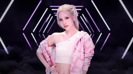 5K Ultra HD PC wallpaper of a blonde model in a pink patterned jacket and white crop top posing confidently against neon geometric stage lights, K-pop–styled.