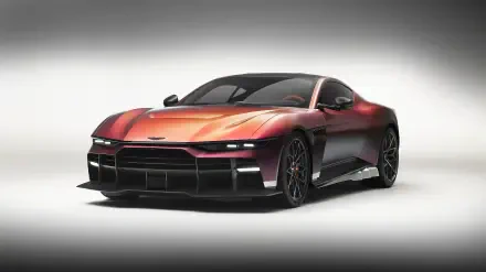 Aston Martin Valen sports car coupé in metallic red, three-quarter front view on a neutral studio backdrop, presented as an 8K Ultra HD PC desktop wallpaper and background.