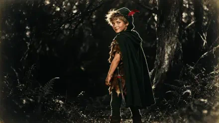 4K Ultra HD PC desktop wallpaper: a child in a Peter Pan–style elf costume with green cloak and feathered cap, standing in a shadowy forest and glancing back.