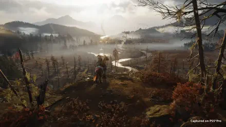 Ghost of Yōtei 4K Ultra HD PC desktop wallpaper: a fog-wreathed forested valley with a winding river, distant mountains, and a lone rider overlooking the misty landscape.