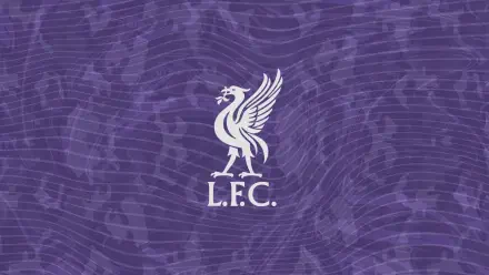 Liverpool F.C. white liver bird logo with L.F.C. centered on a textured purple wavy background — 2K Quad HD PC desktop wallpaper.