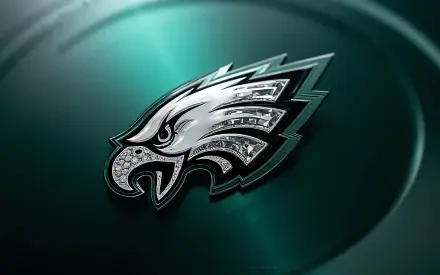 Philadelphia Eagles NFL metallic eagle logo on a dark green glossy background — 4K Ultra HD PC desktop wallpaper.