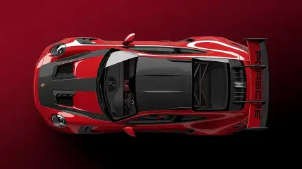 Top-down view of a red Porsche GT3 RS supercar on a deep red backdrop — 4K Ultra HD PC desktop wallpaper and background.
