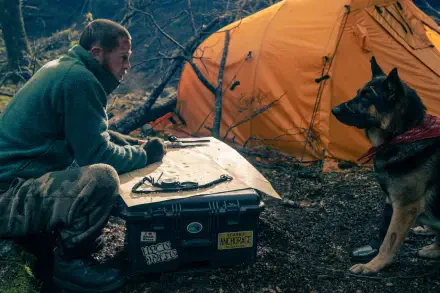 Brad Pitt camping beside an orange tent with a dog in Heart of the Beast HD desktop wallpaper background.