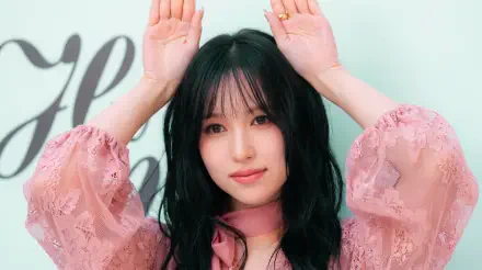 TWICE and MiSaMo member Mina, Japanese model and K-pop idol, poses in a pink blouse in this 5K Ultra HD desktop wallpaper.