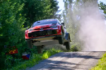 Toyota Gazoo Racing GR Yaris Rally1 rally car airborne on a forest road during WRC action, 4K Ultra HD desktop wallpaper.