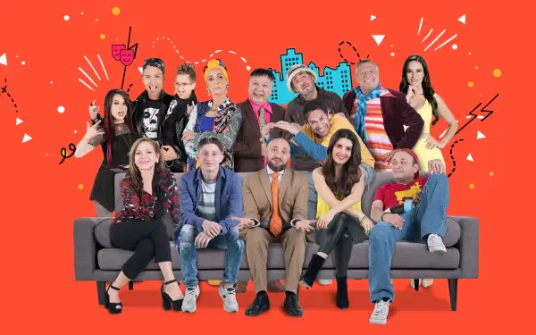 4K Ultra HD PC desktop wallpaper showing the Vecinos ensemble seated on a couch against a bold red backdrop with stylized city skyline accents.