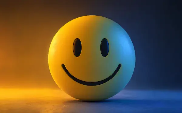 Glossy yellow smiley sphere centered on a warm orange to cool blue gradient — 4K Ultra HD PC desktop wallpaper and background.