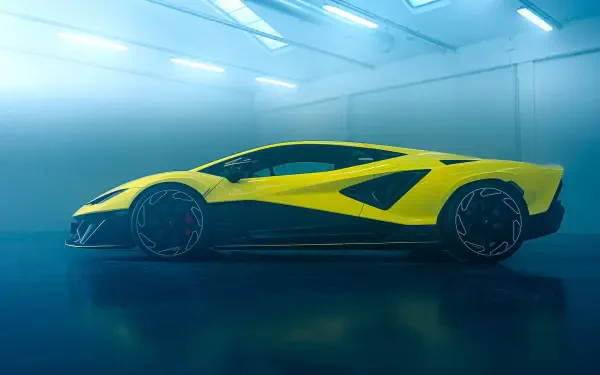 Yellow Lamborghini Fenomeno sports vehicle in a glossy studio setting, 2K Quad HD PC desktop wallpaper/background.