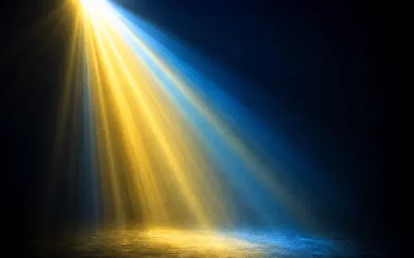 4K Ultra HD PC desktop wallpaper: a dramatic beam of golden and blue light slanting onto a misty surface against a deep, dark background.