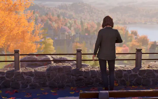 4K Ultra HD PC desktop wallpaper from the video game Life Is Strange: Reunion — a character stands on a stone overlook, watching autumn foliage and a distant lake, a suitcase and bench nearby.