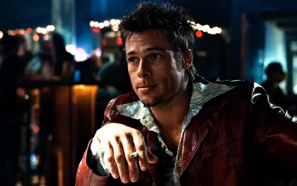 Smirking man in a red leather jacket leans on a dim bar counter; moody Fight Club 4K Ultra HD PC desktop wallpaper and background.