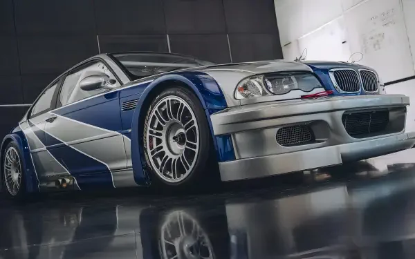4K Ultra HD PC desktop wallpaper: customized BMW car in Need For Speed: Most Wanted style, blue-and-silver livery with widebody kit and racing wheels.