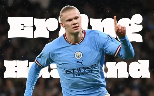 HD desktop wallpaper of a Manchester City F.C. forward in sky-blue kit celebrating with finger raised, bold white name-style text behind him.