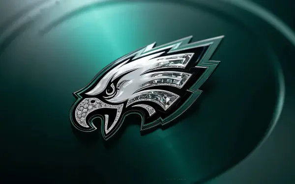 Philadelphia Eagles NFL metallic eagle logo on a dark green glossy background — 4K Ultra HD PC desktop wallpaper.