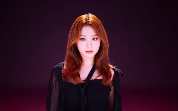 Close-up portrait of a redhead K-pop idol in a black top against a deep magenta backdrop — polished 5K Ultra HD PC desktop wallpaper and background.