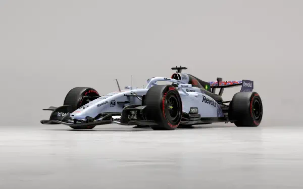 Audi R26 F1 race car in a sleek studio setting, featured in a 4K Ultra HD PC desktop wallpaper and background.