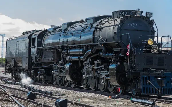 Union Pacific Big Boy 4014 steam locomotive on railroad tracks, featured in a HD PC desktop wallpaper and background.