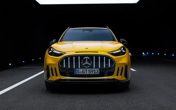 Yellow Mercedes-AMG GT SUV on a dark road, featured in a 2K Quad HD PC desktop wallpaper background.