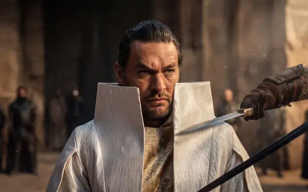 Jason Momoa holds a sword in Dune: Part Three, featured in a 5K Ultra HD desktop wallpaper and background.