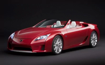 Red convertible sports car (vehicle, car) on a dark studio backdrop, high-resolution HD PC desktop wallpaper and background.