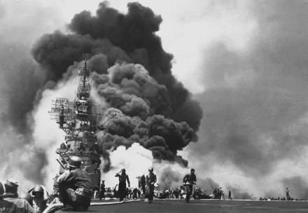 A dramatic black-and-white image depicting a military scene with soldiers amidst an intense explosion and thick black smoke, creating a striking HD desktop wallpaper background.