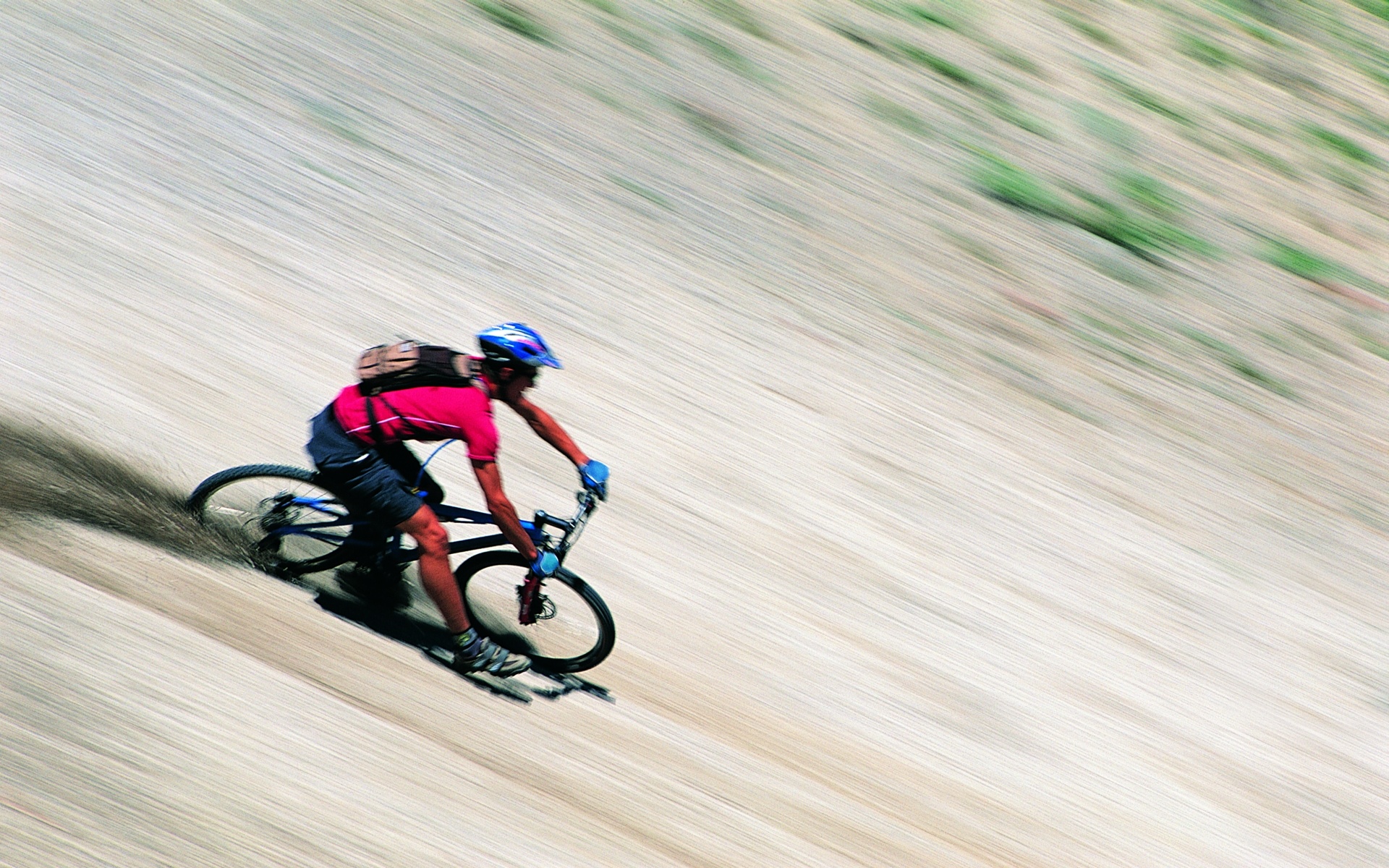 Vibrant sports-themed desktop wallpaper featuring a mountain bike, perfect for the adventurous.