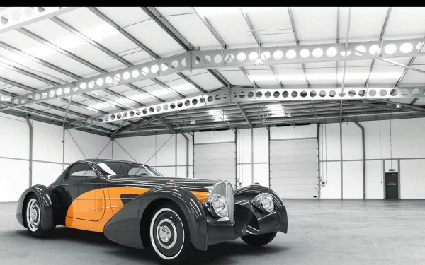 HD PC desktop wallpaper featuring a classic Delahaye vehicle with sleek black and orange design inside a spacious, well-lit industrial garage.