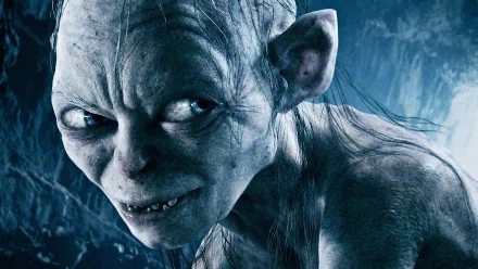 Close-up of Gollum, a character from *The Lord of the Rings: The Return of the King*, featuring detailed facial features against a dark, mysterious background. HD wallpaper for PC.