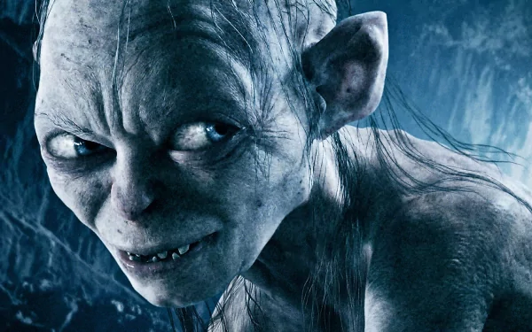 Close-up of Gollum, a character from *The Lord of the Rings: The Return of the King*, featuring detailed facial features against a dark, mysterious background. HD wallpaper for PC.