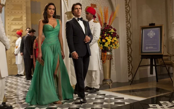Movie still from Mission: Impossible - Ghost Protocol featuring two characters dressed elegantly in a glamorous venue. This HD desktop wallpaper and background showcases a stylish scene from the film.