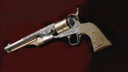 A beautifully detailed revolver, showcasing intricate engravings and a striking design, set against a rich background, serving as an eye-catching HD desktop wallpaper.