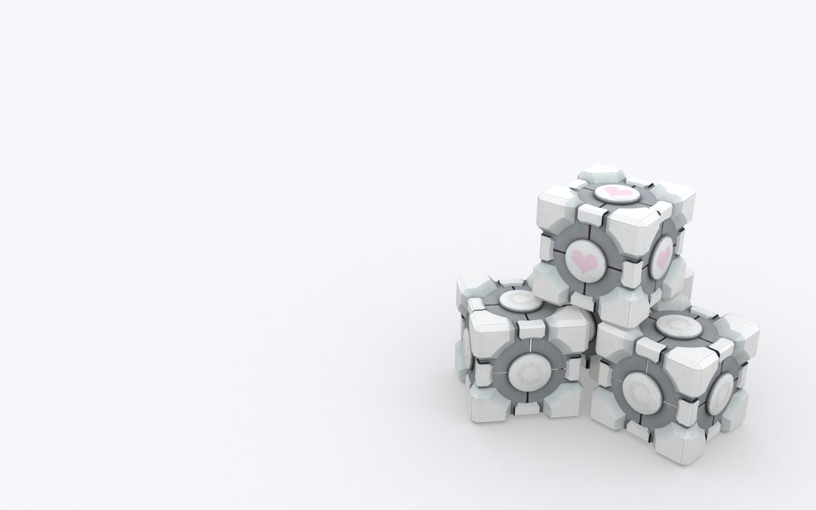 Three colorfully patterned cubes lined up in a row, resembling the Companion Cube from the video game Portal.