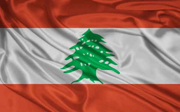 HD desktop wallpaper featuring the flag of Lebanon with its iconic green cedar tree on a wavy red and white background.